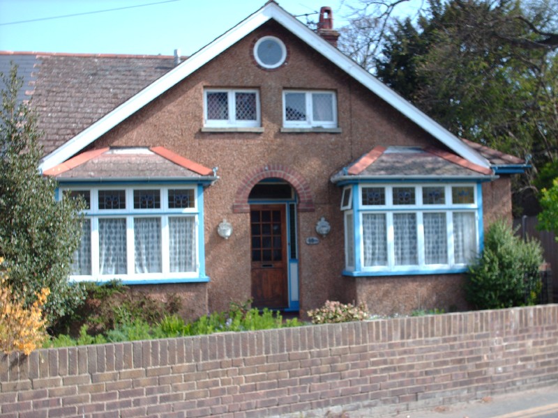 View Of Bungalow With Odd Shaped Windows
